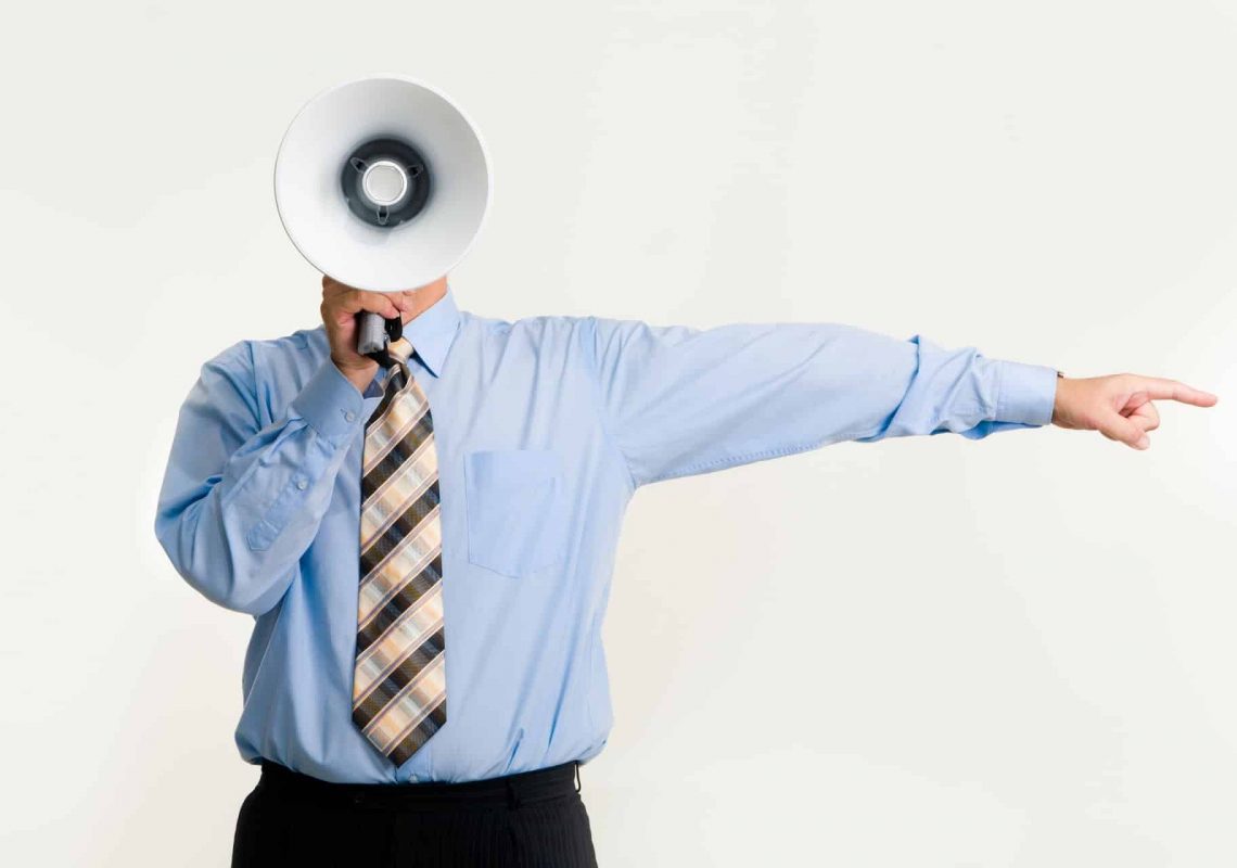 man-with-megaphone-pointing-3851255